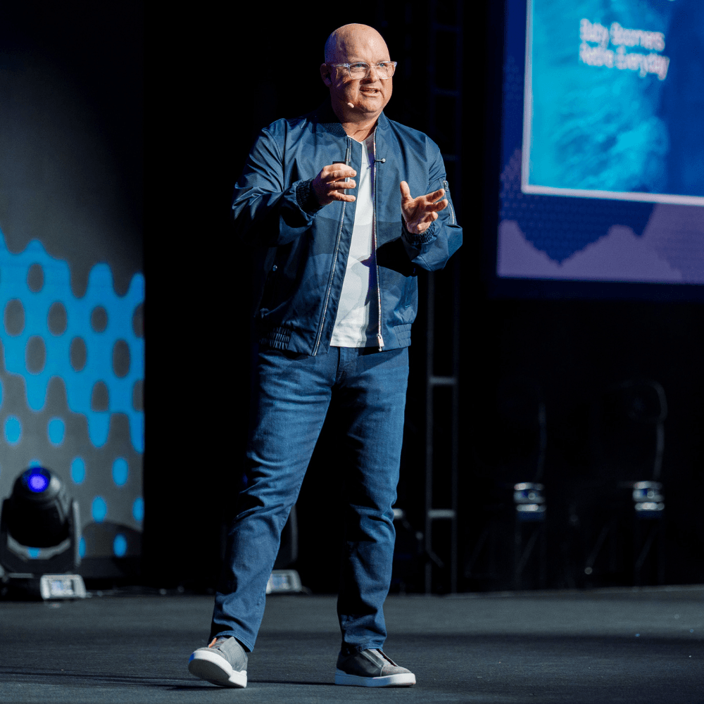 Vic Keller speaking on stage