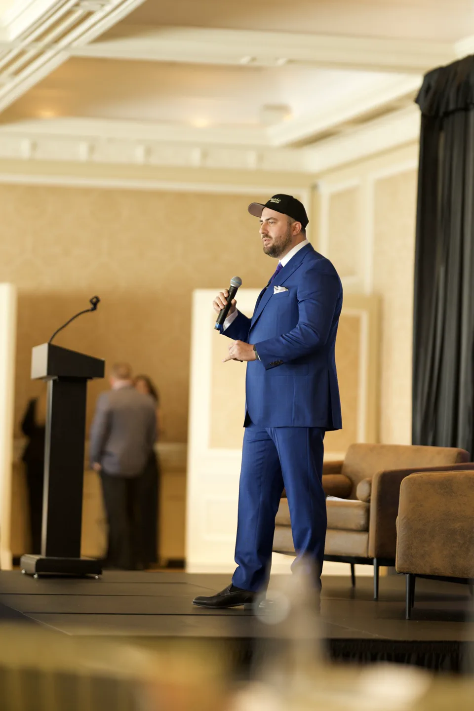 Michael Steinberg speaking on stage with a microphone